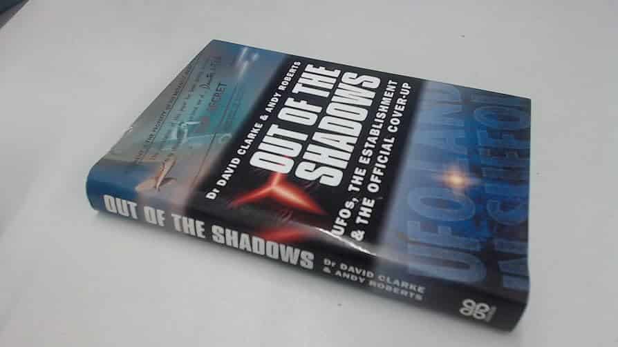 A hardback copy of "Out of the Shadows: UFOs, The Establishment & the Official Cover-Up" by Dr David Clarke and Andy Roberts, as sold on Amazon.