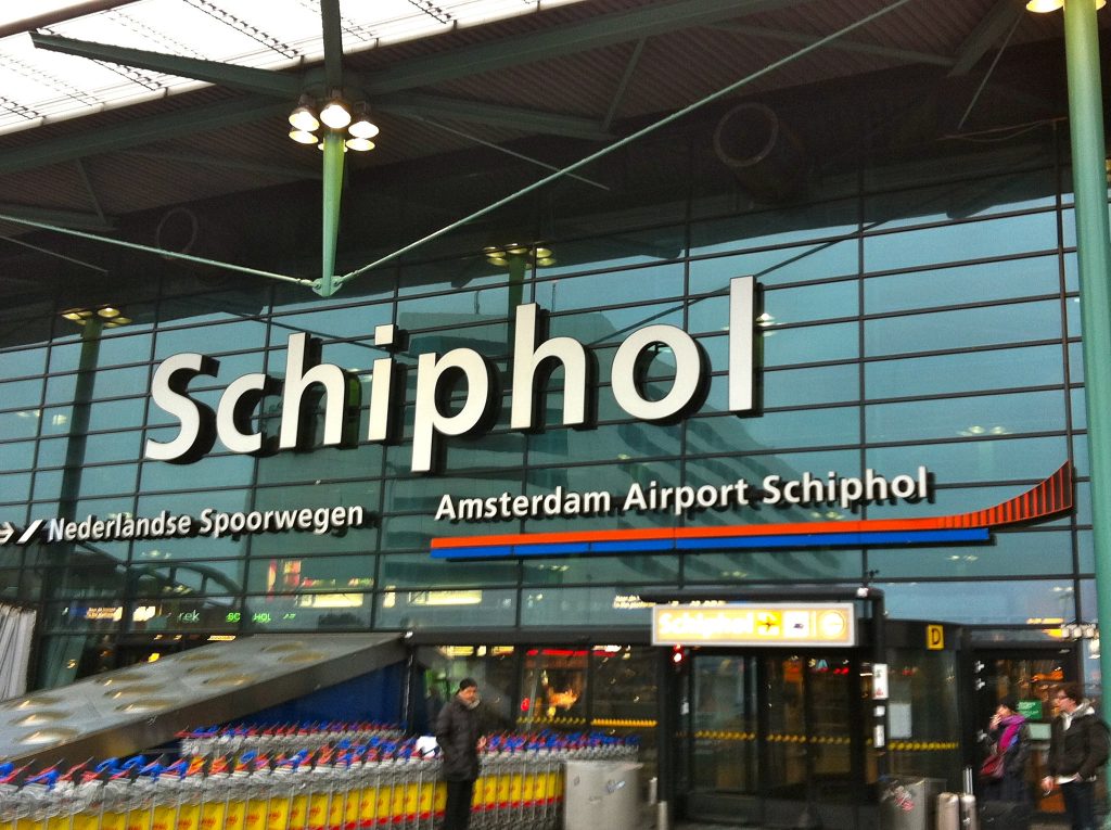 A glass-fronted entrance to Schiphol airport in Amsterdam