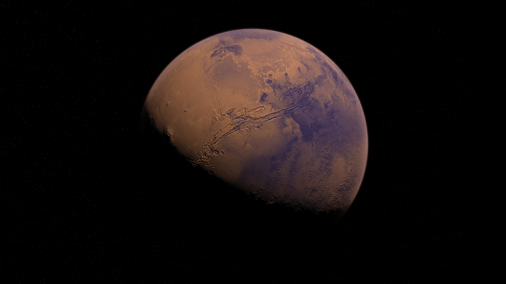 An image of the planet Mars floating in the black of space, around half of the planet is lit and visible from the top-right