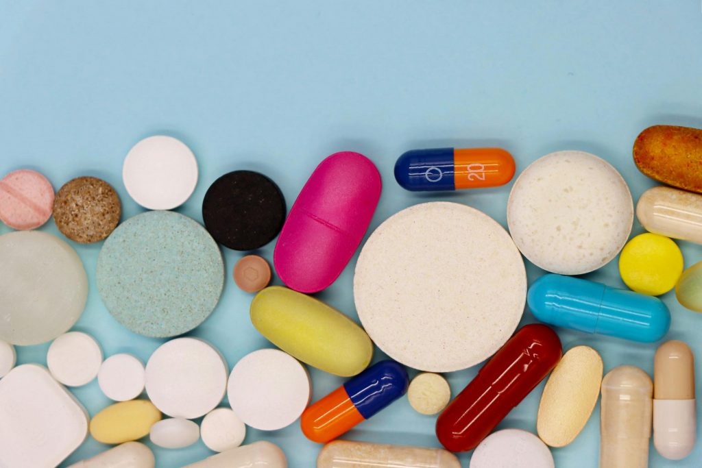 A variety of pills of different colours, shapes and sizes