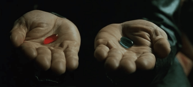 Picture from the movie The Matrix where Morpheus holds out the red pill and blue pill, representing the choice between waking up and staying asleep.