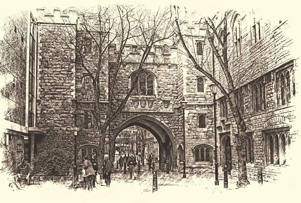 A heavily filtered and stylised photograph of the St John's gate in central London, with some people moving through the main arch. The photo is slightly yellowed and has effects around the edges mimicking an old-style monochrome photograph