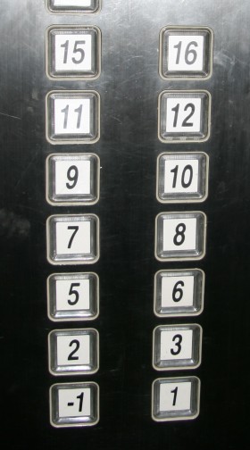 A lift floor selection panel from 2006, in a residential apartment block in Shanghai, showing floors -1 to 16. Floors 0, 4, 13 and 14 are missing.